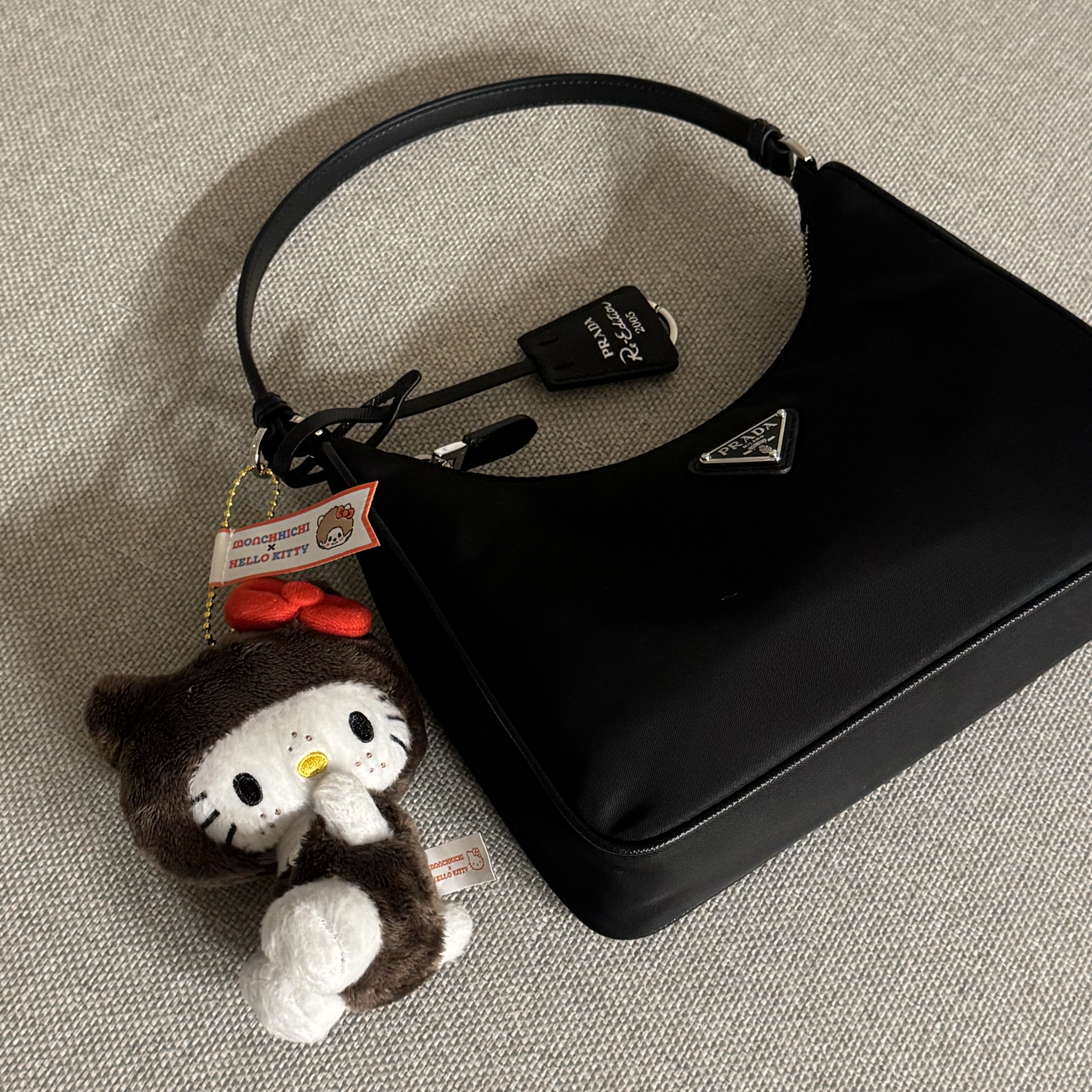 Prada Re-Edition 2005 Re-Nylon Mini Hobo Bag Black, Sanrio Hello Kitty x Monchhichi 50th Anniversary Hello Kitty Holder 착용 스타일