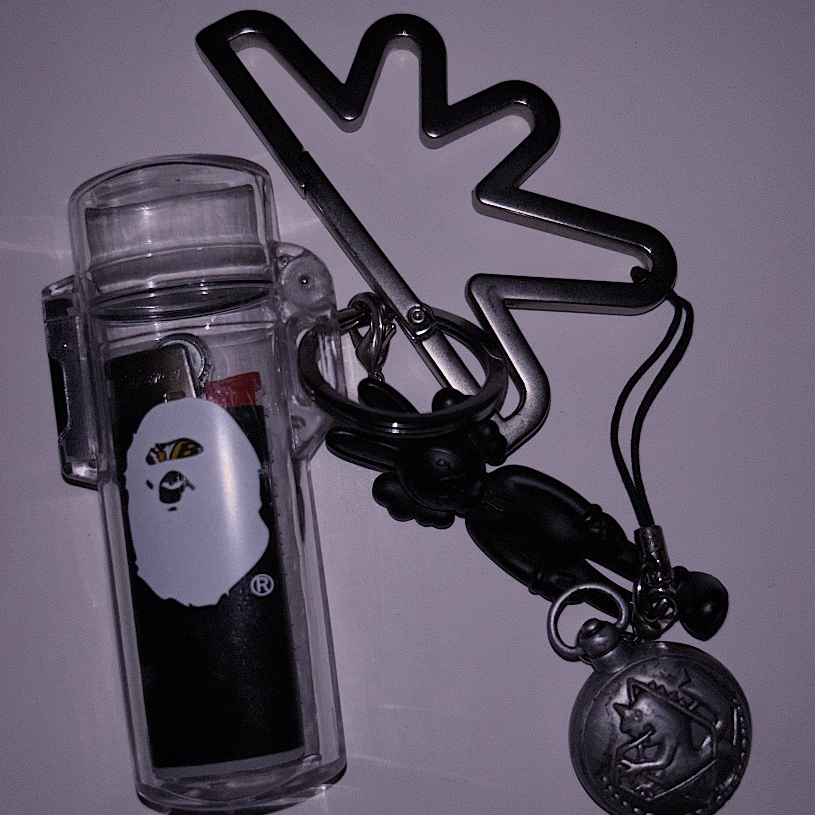 BAPE Neon Camo Lighter Case Keychain Silver, Kaws Tokyo First Companion Keychain Black 착용 스타일