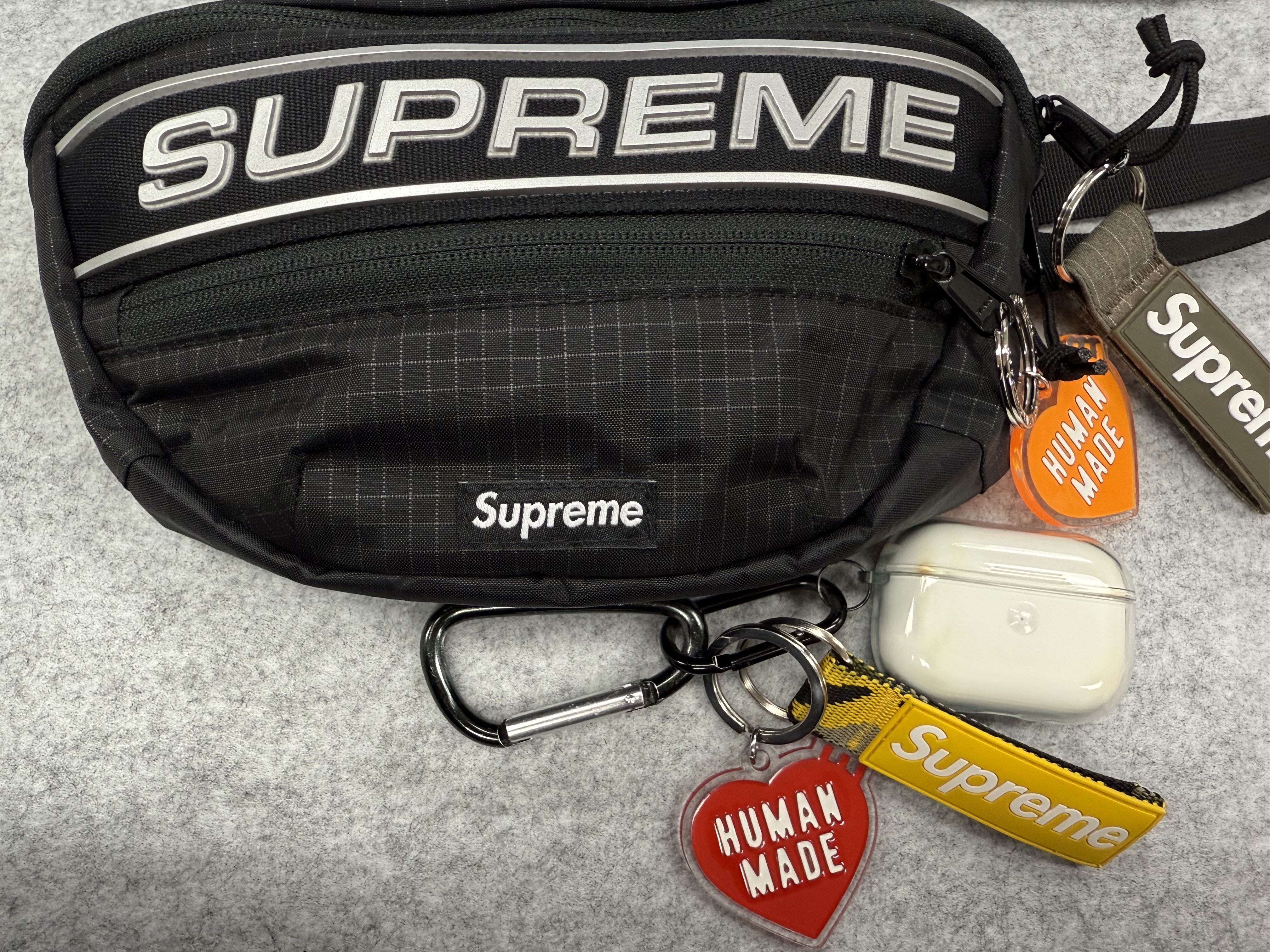 Supreme Waist Bag Black - 23FW, Supreme Webbing Keychain Yellow Camo - 23SS 착용 스타일