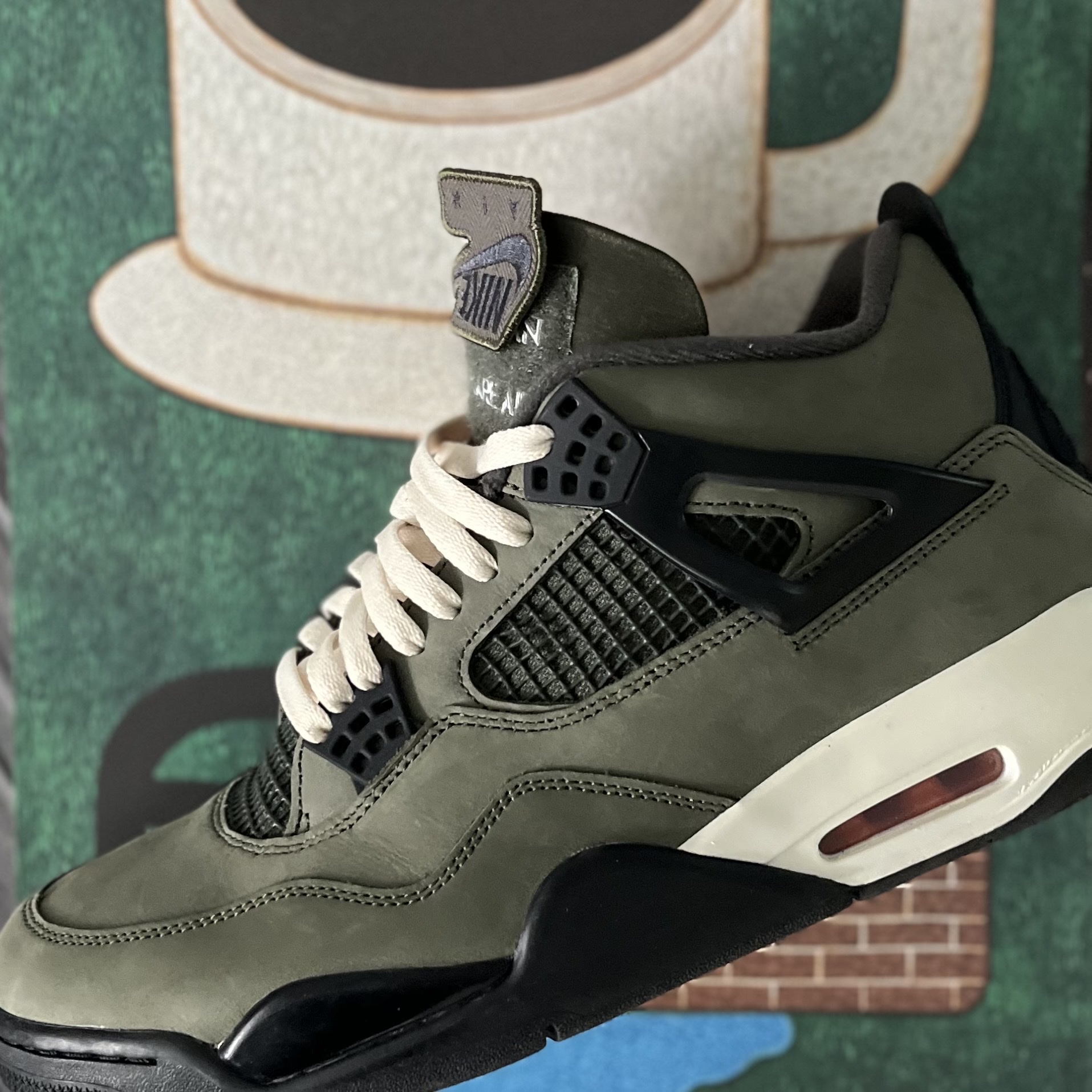 Jordan 4 x Undefeated Retro OG SP Deep Green and Clementine 착용 스타일