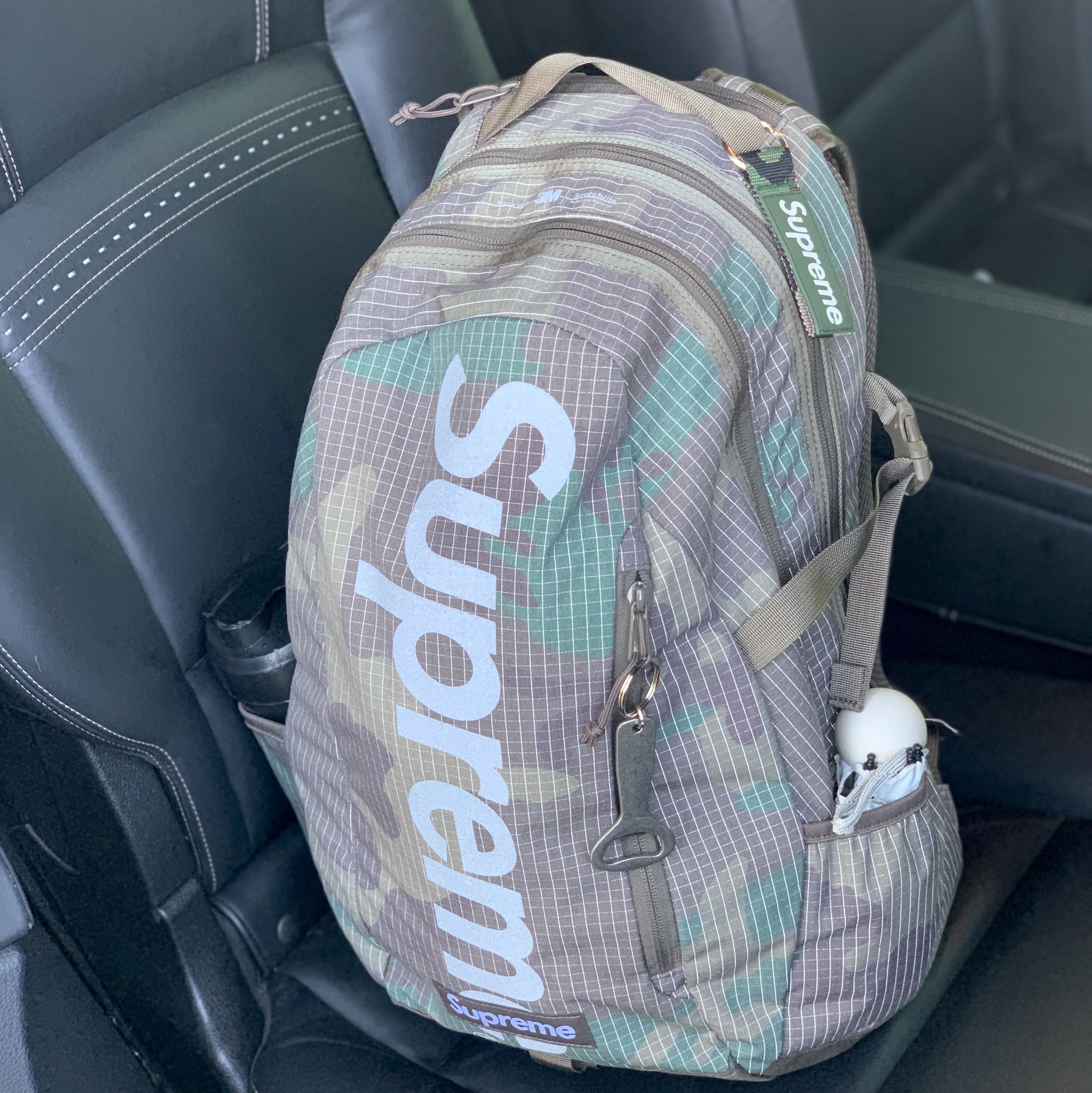 Supreme Backpack Woodland Camo - 24SS, Supreme Webbing Keychain Green Camo - 23SS 착용 스타일