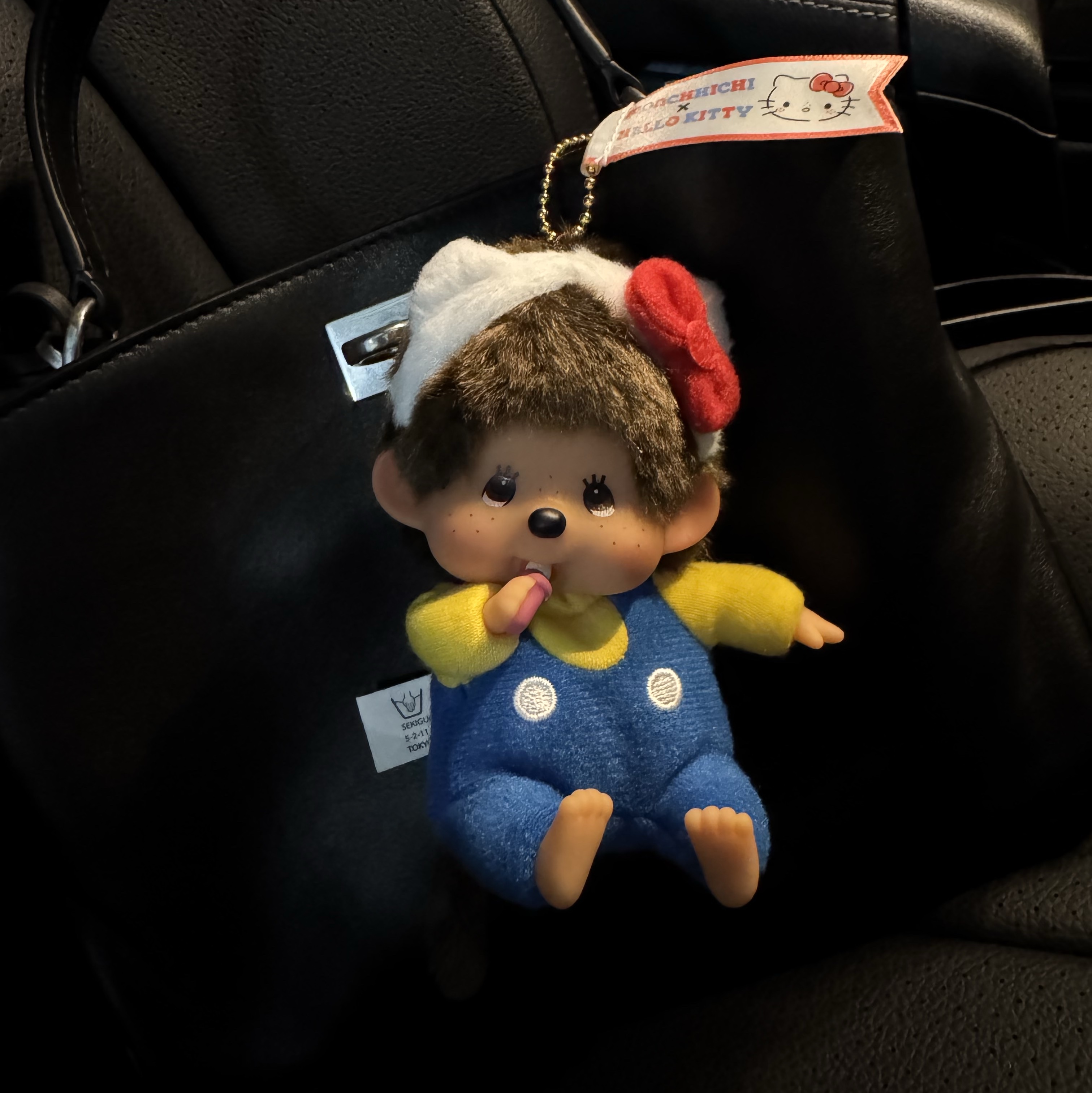 Sanrio Hello Kitty x Monchhichi 50th Anniversary Monchhichi Holder, Balenciaga Rodeo Mini Handbag Black 착용 스타일