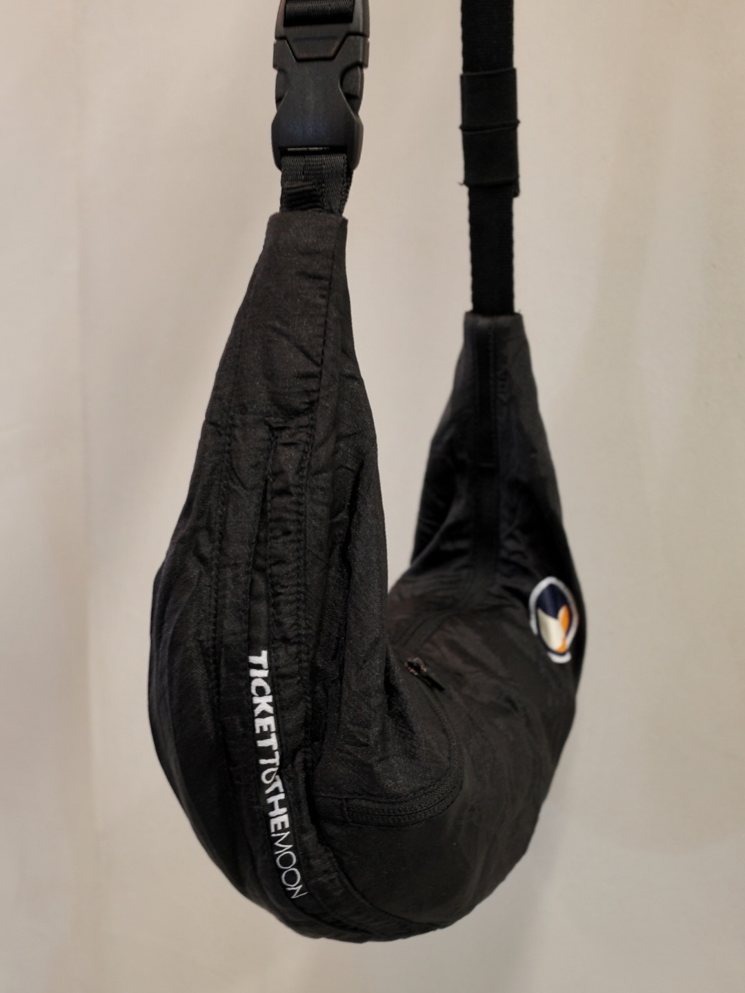 Ticket to the Moon Upcycled Sling Bag Black 착용 스타일