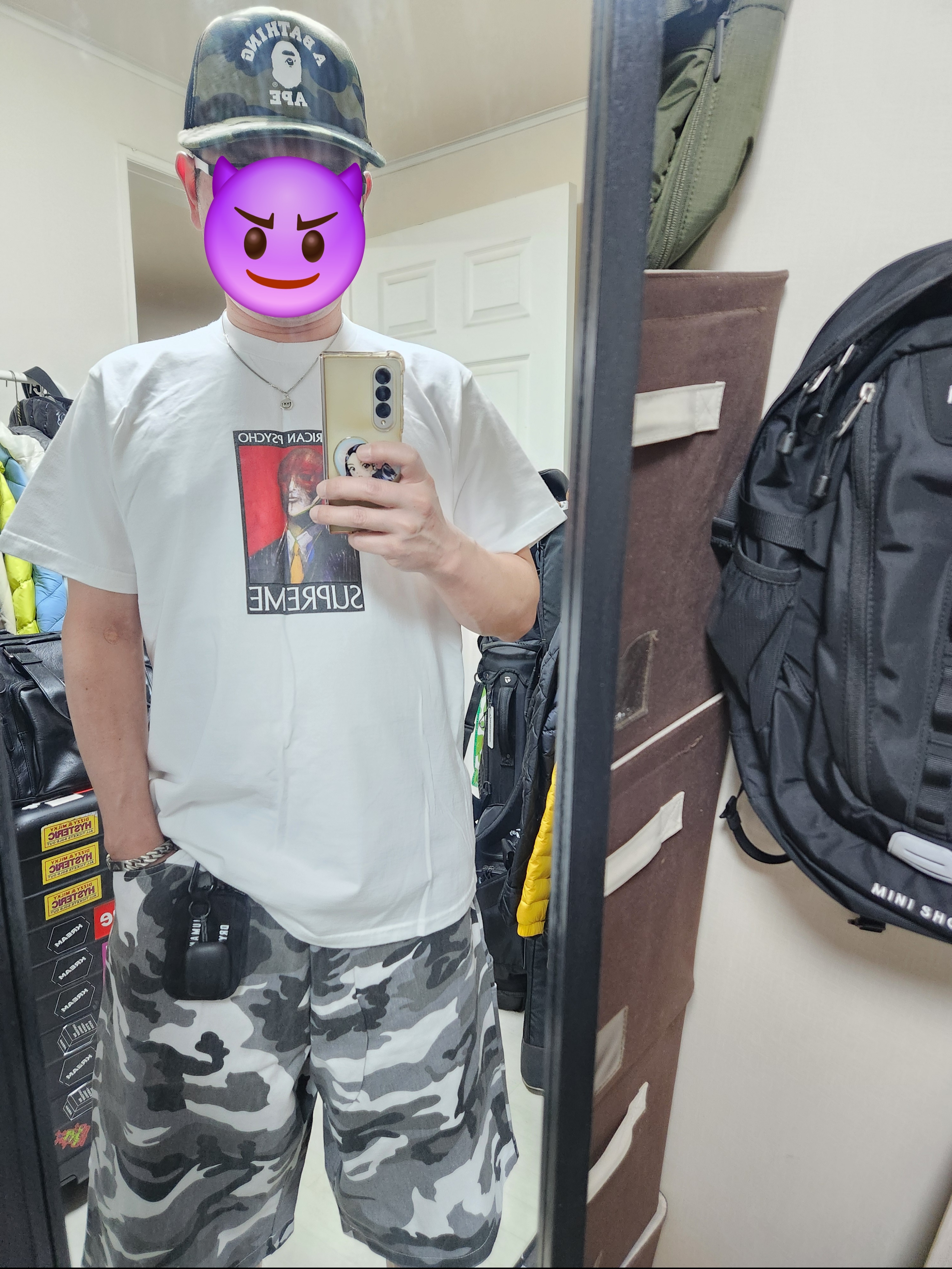 Supreme American Psycho T-Shirt White - 23FW, BAPE 1st Camo College Mesh Cap Green 착용 스타일