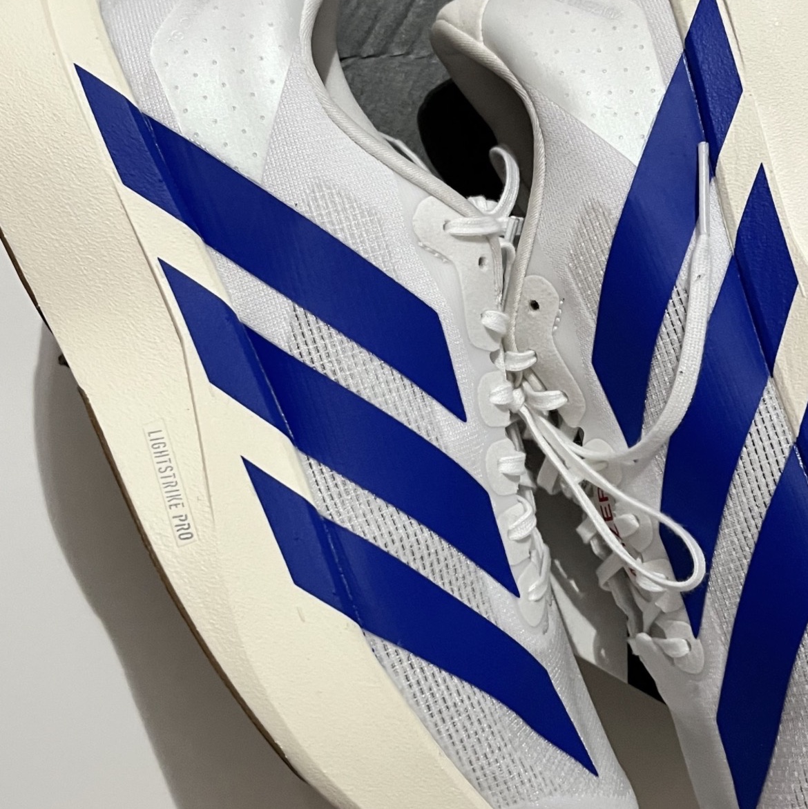 Adidas Adizero EVO SL Cloud White Royal Blue, Supreme Stripe Flannel Zip Up Shirt Brown - 23FW 착용 스타일 - 1