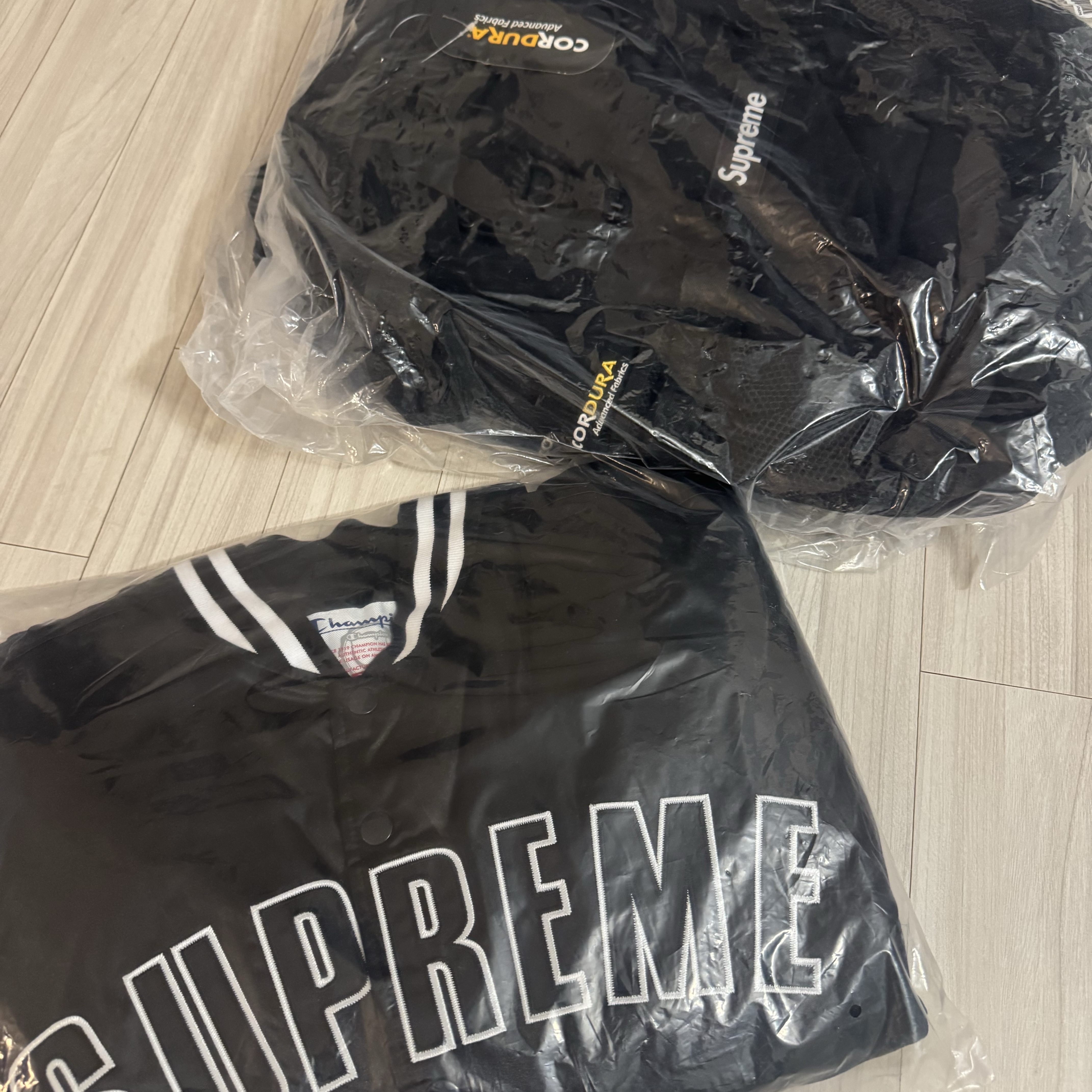 Supreme x Champion Satin Varsity Jacket Black - 26SS 착용 스타일
