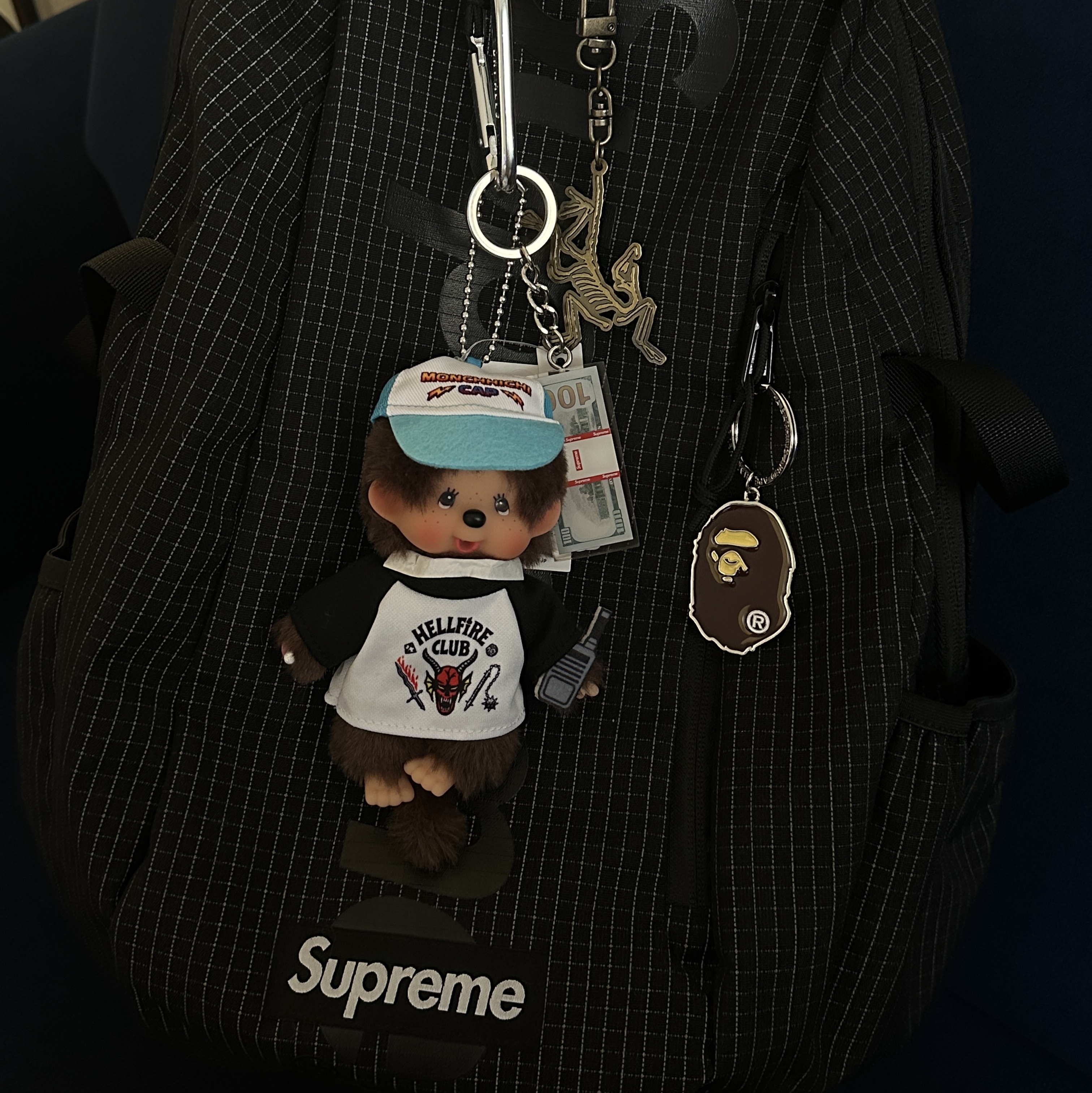 Monchhichi x Strange Things Key Chain Hellfire Club, Supreme Backpack Black - 24SS 착용 스타일