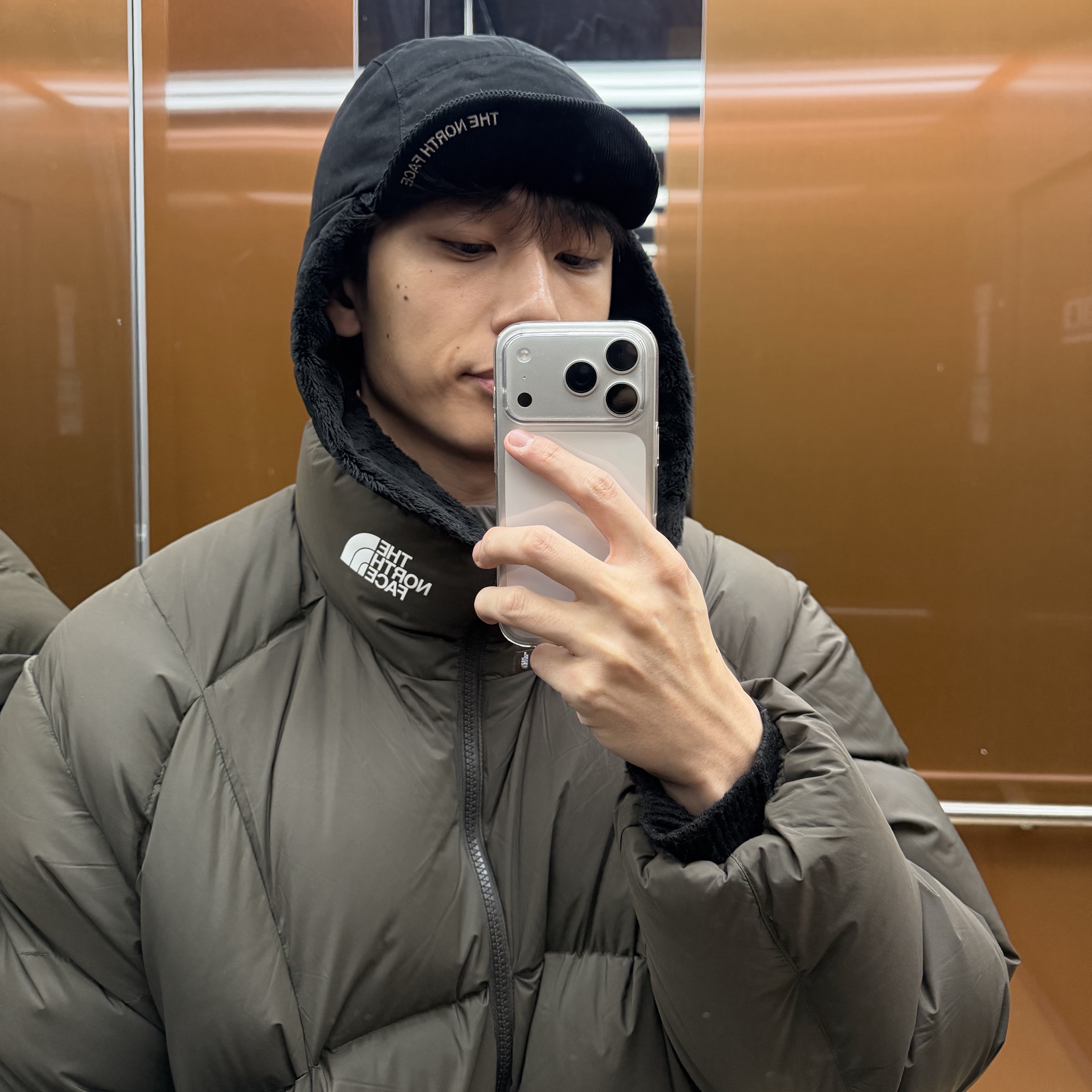 The North Face 1996 Eco Nuptse Jacket Brown, The North Face Waxed Cotton Earmuff Cap Black - 25FW 착용 스타일 - 3