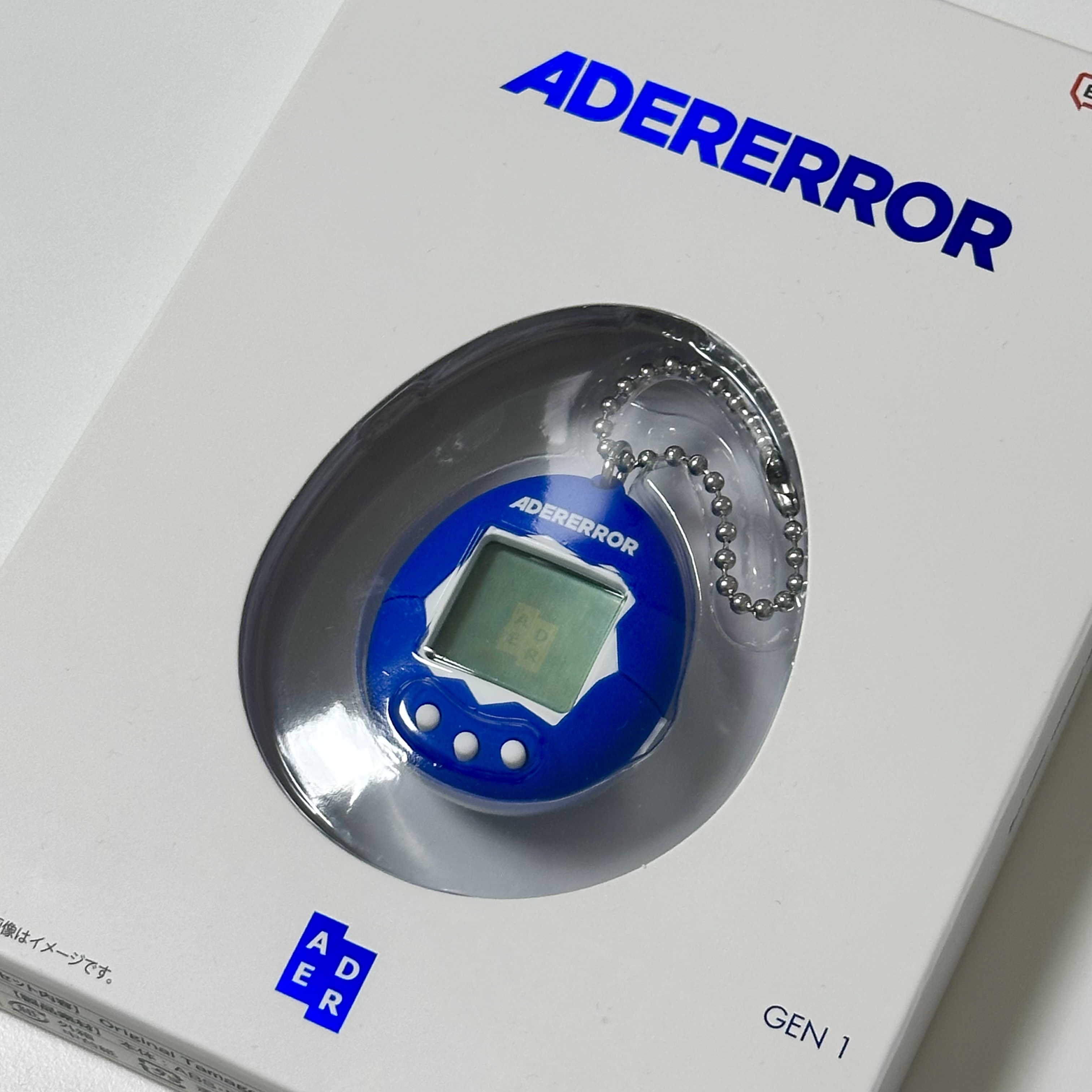 Ader Error x Bandai Original Tamagotchi Z-Blue 착용 스타일
